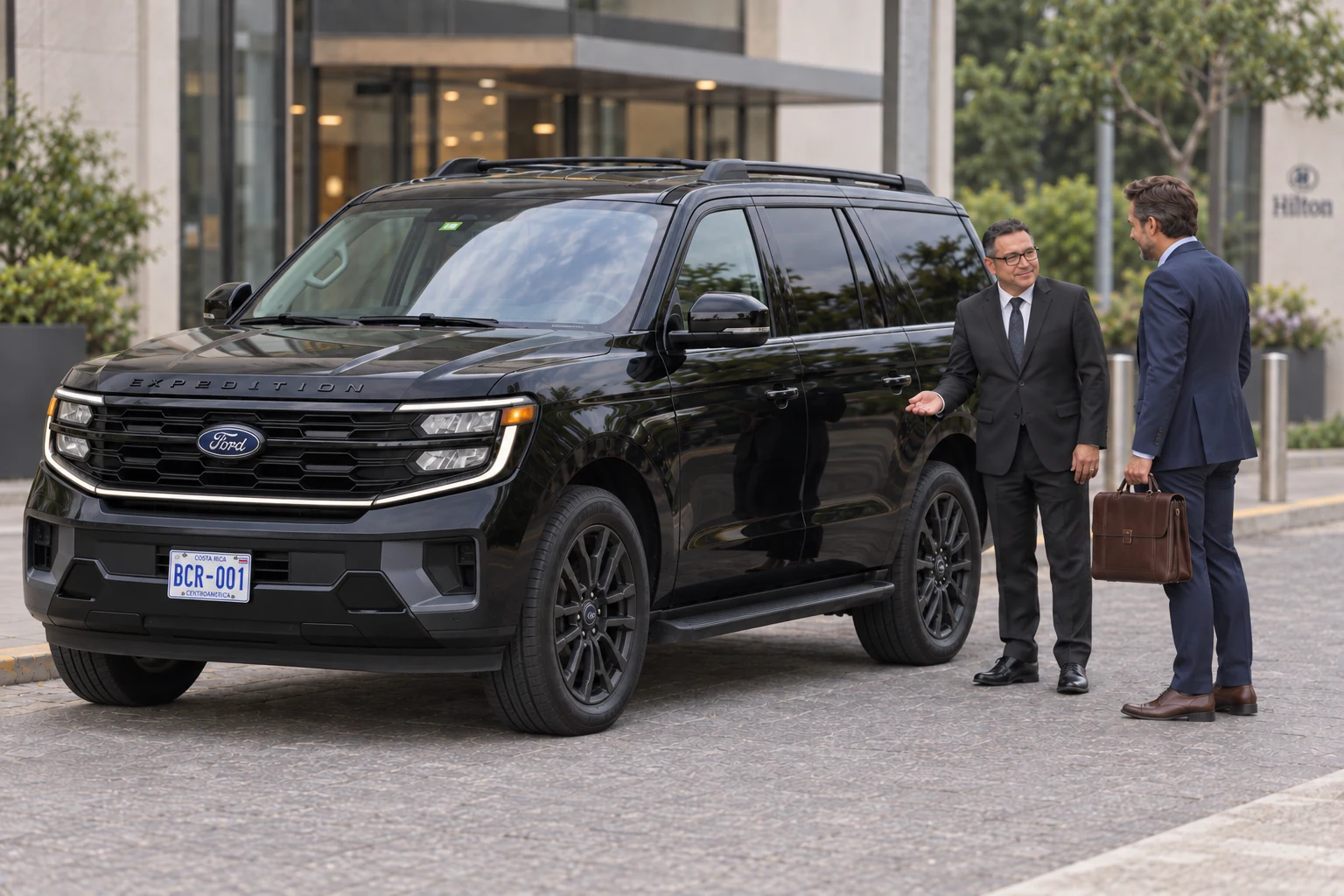 A private driver greets a business traveler beside a Ford Expedition