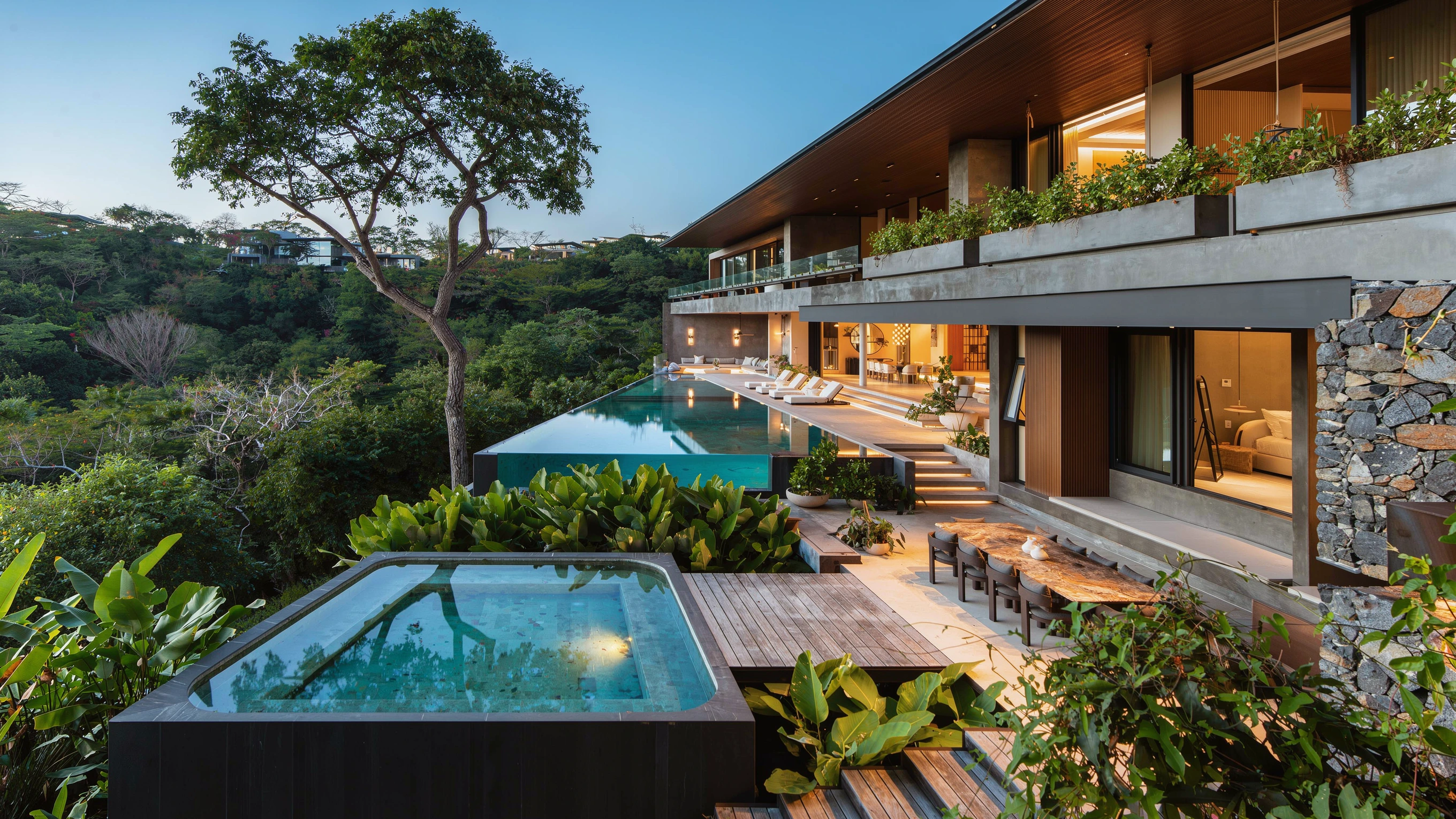 AI-enhanced photograph of the Sanctuary Villa infinity pool, hot tub and terraces surrounded by tropical trees in Peninsula Papagayo