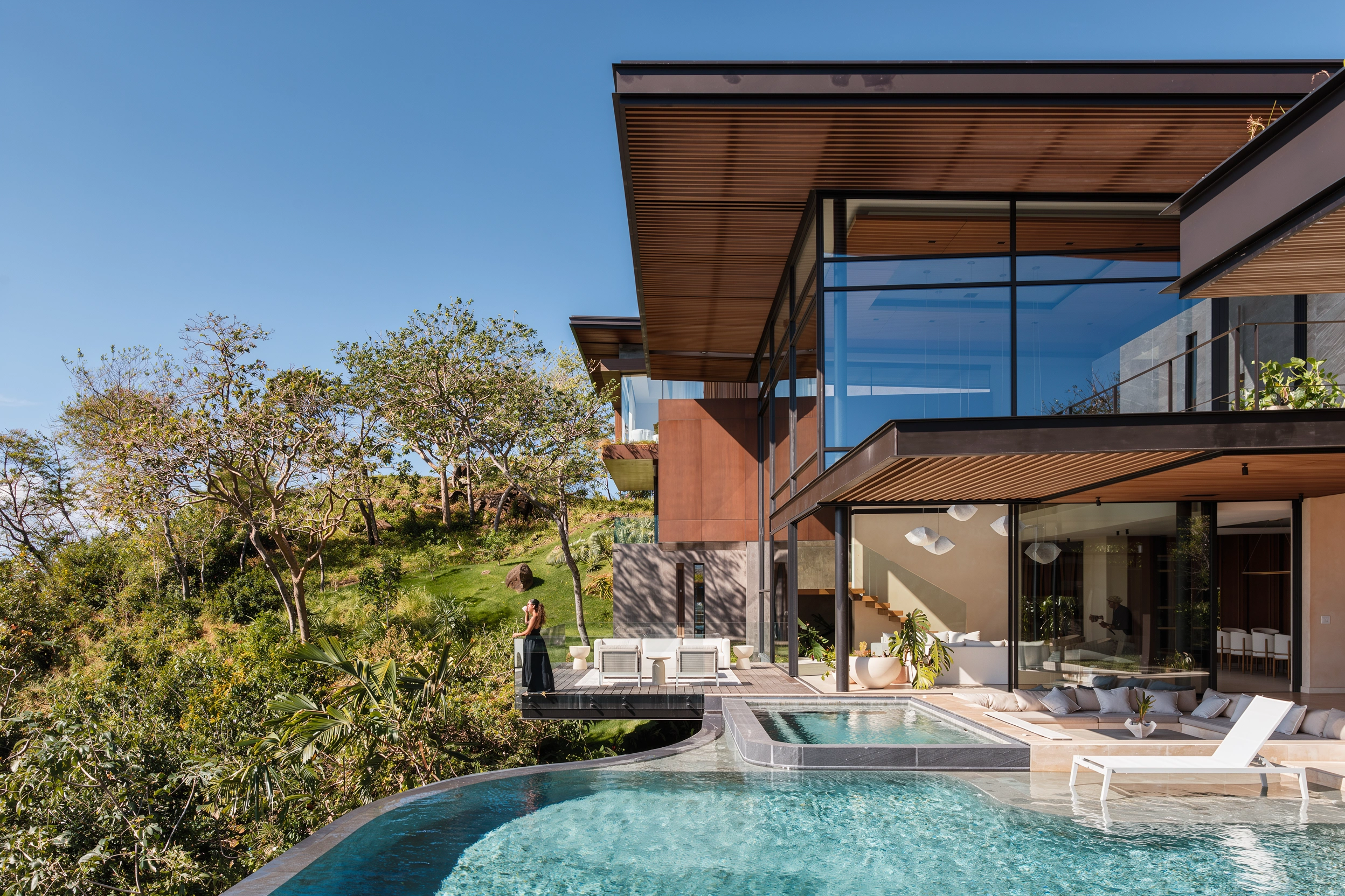 AI-enhanced photograph of the Horizon Pool Villa's glass-lined living areas and pool terrace