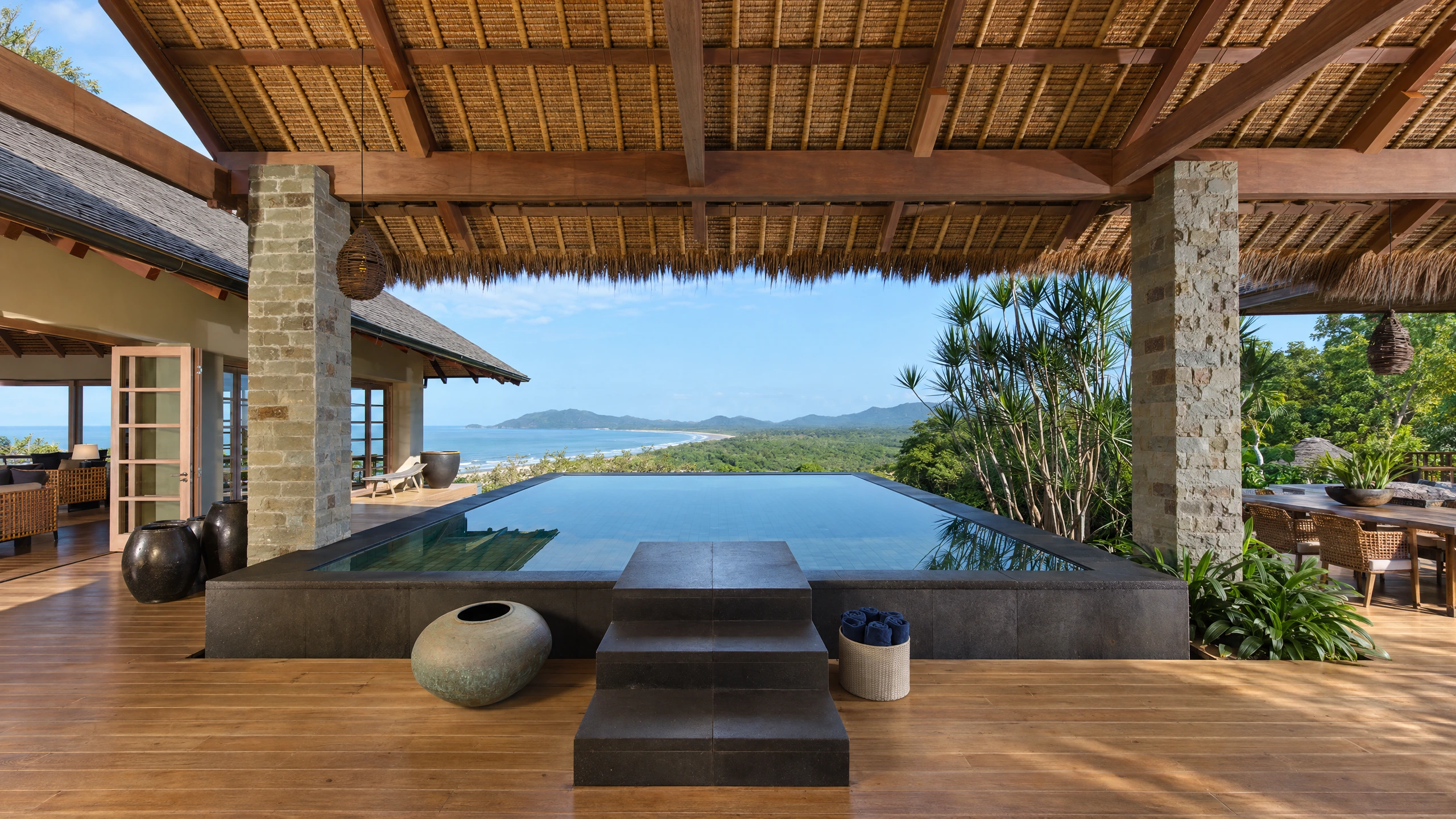 AI-enhanced photograph of Tamarindo 8BR Balinese Villa: pool and timber pavilion