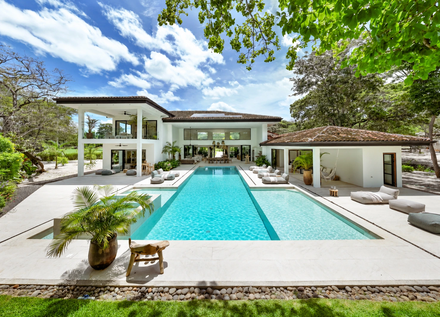 AI-enhanced photograph of Hacienda Pinilla 7BR Modern Villa: daytime pool terrace